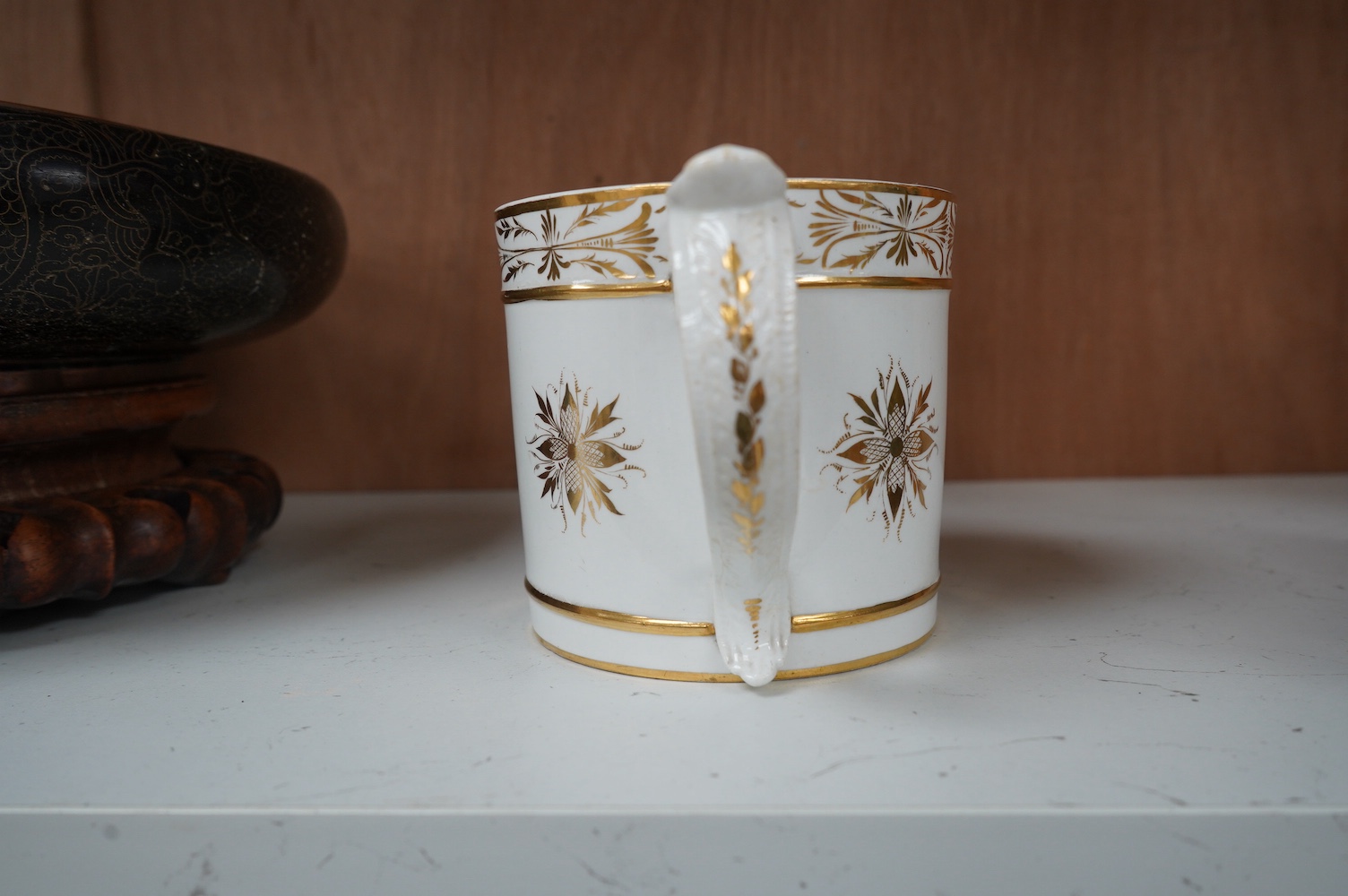 A Bloor Derby ‘Porter’ mug, c.1800-10, painted with a country scene, in the manner of Daniel Lucas, 11cm high. Condition - crack to base internally